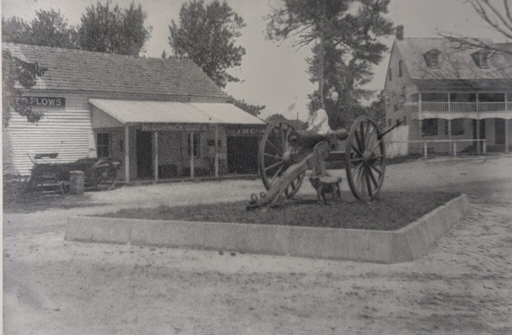 Pole Tavern circa 1900 with a farm machinery business to the left the Pole Tavern Inn to the far right and Pole Tavern Cannon in the middle. Photo from the Robert P. Dorrel Collection