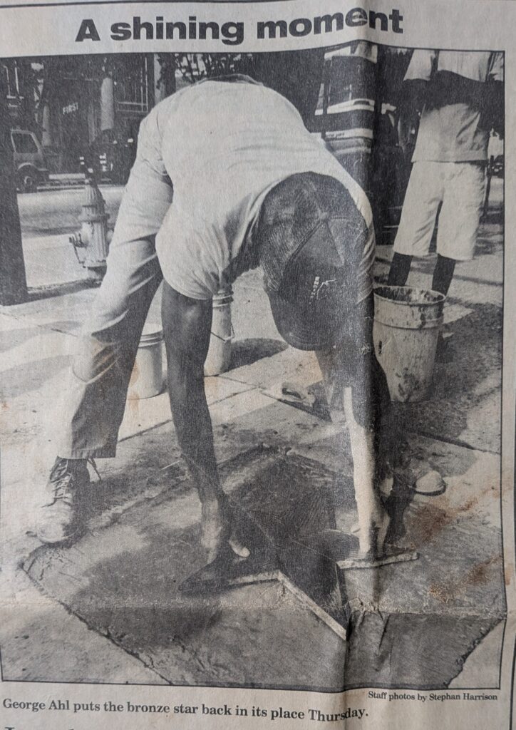 George Ahl placing the brass Salem star into the sidewalk on Thursday August 22, 1996. Credits: Today's Sunbeam staff photo by Stephen Harrison