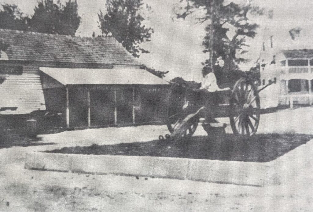 Il Lugano cannon in 1901 with a girl sitting atop and dog underneath with Pole Tavern in the back right photo credits: Robert P. Dorrell