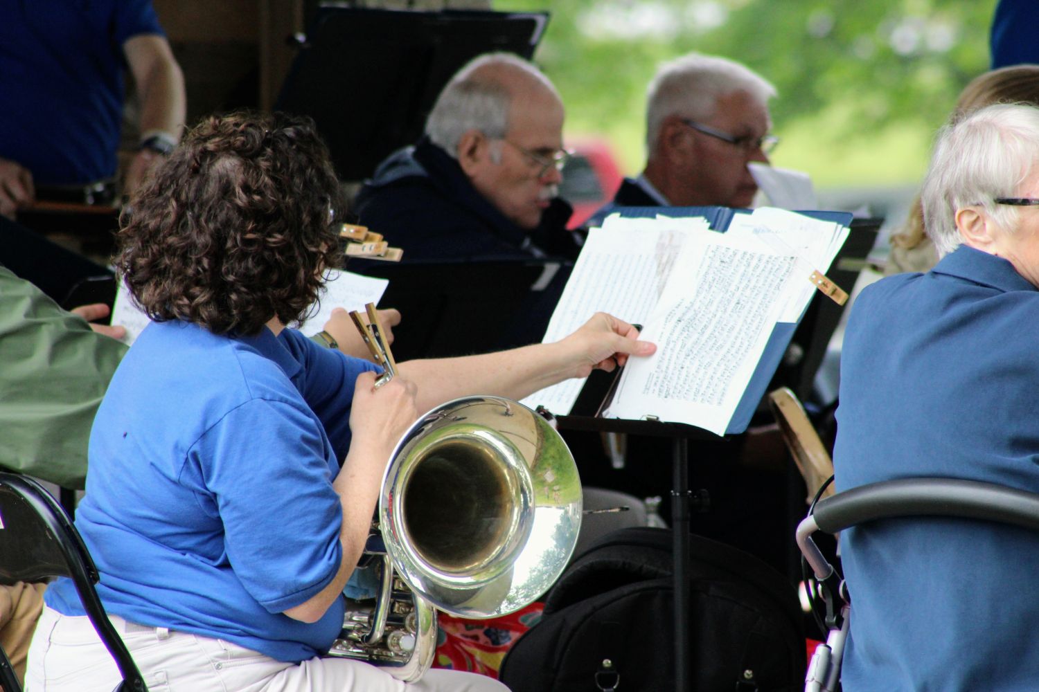 Band member flips over music sheet during performance