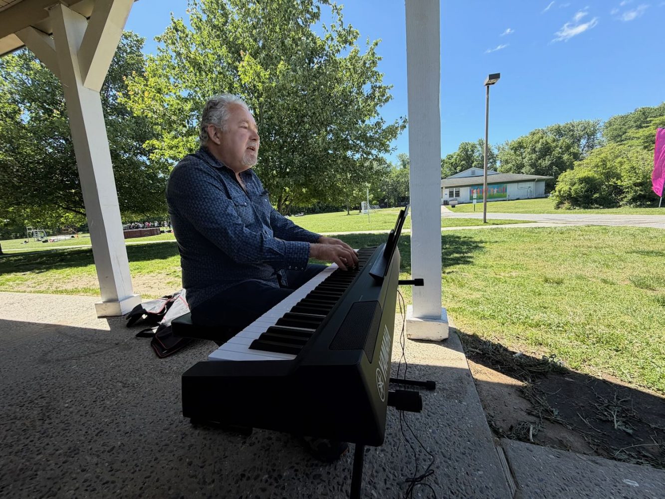 Trey Smith playing his piano at South Jersey Arts Fest