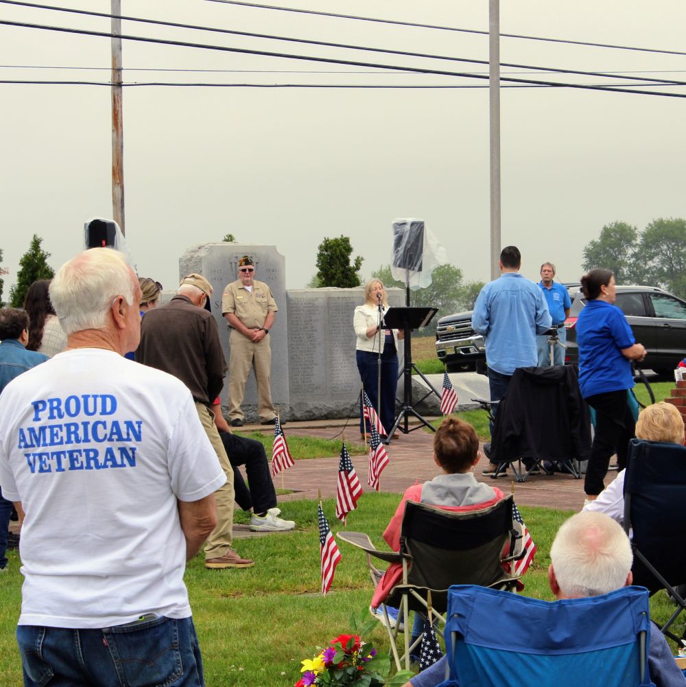Woman speaks during the services at the ceremony