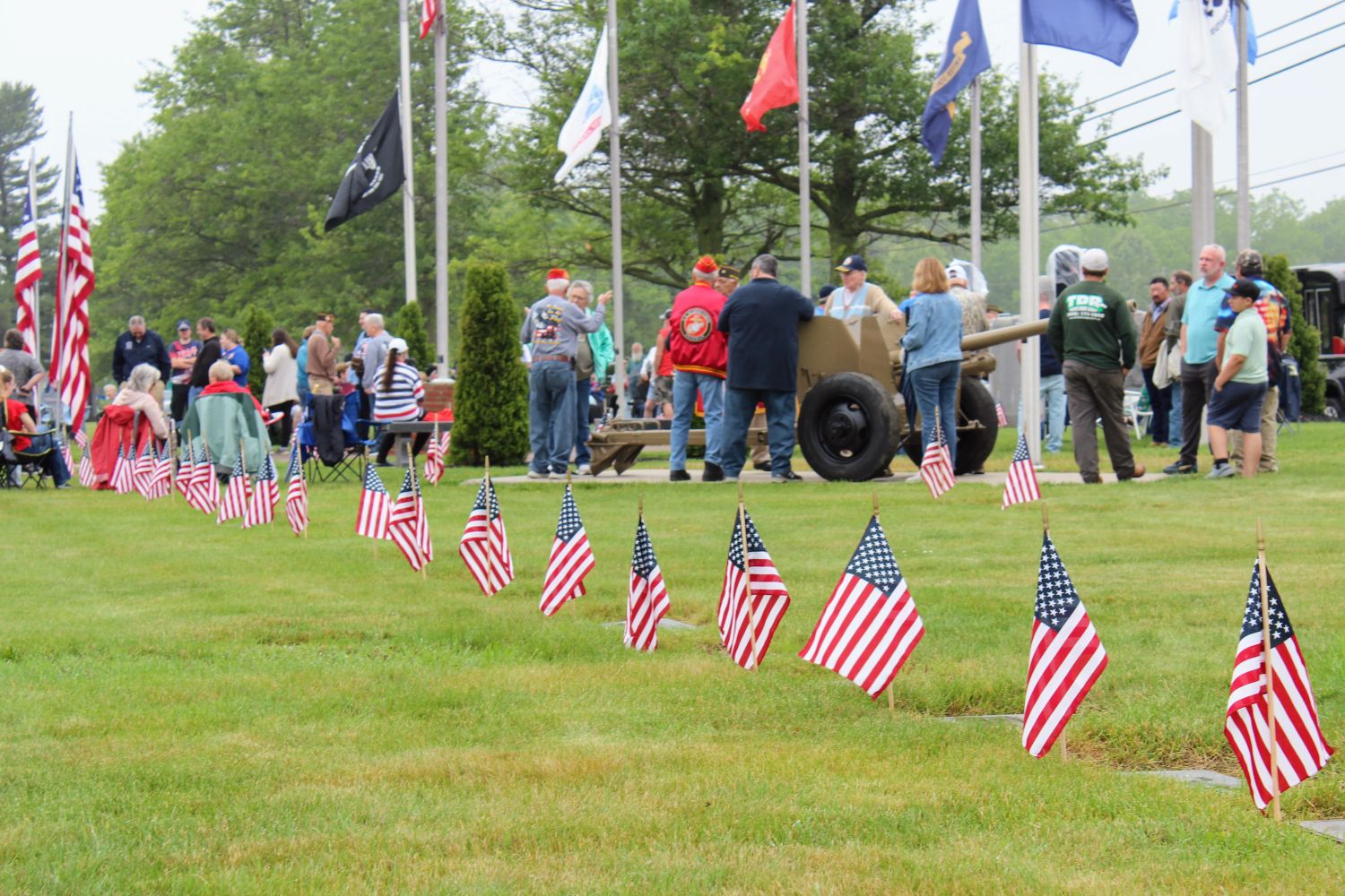 People gather and speak before services begin on Memorial Day