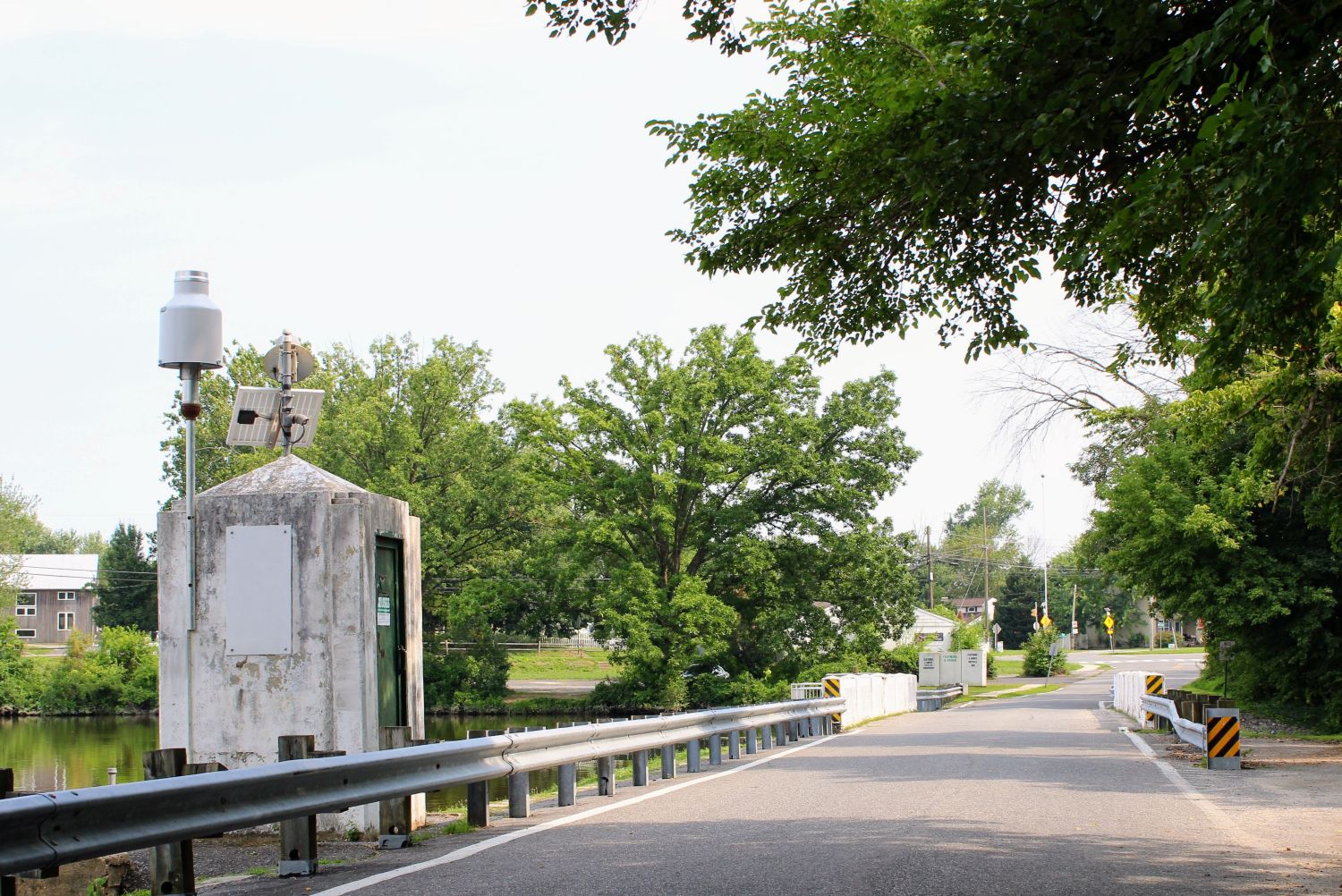 Mill St. that runs atop the earthen dam with the infamous cement Porta-Pot Looking Control Bunker that resembles a part of German North European Coastal Defense Bunker
