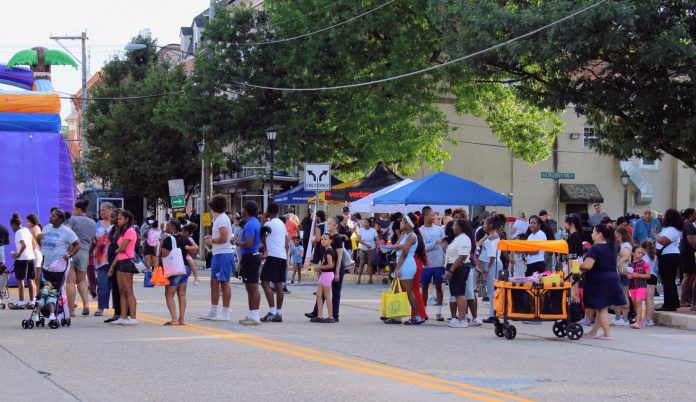 Crowd waiting in line for something to cool down with