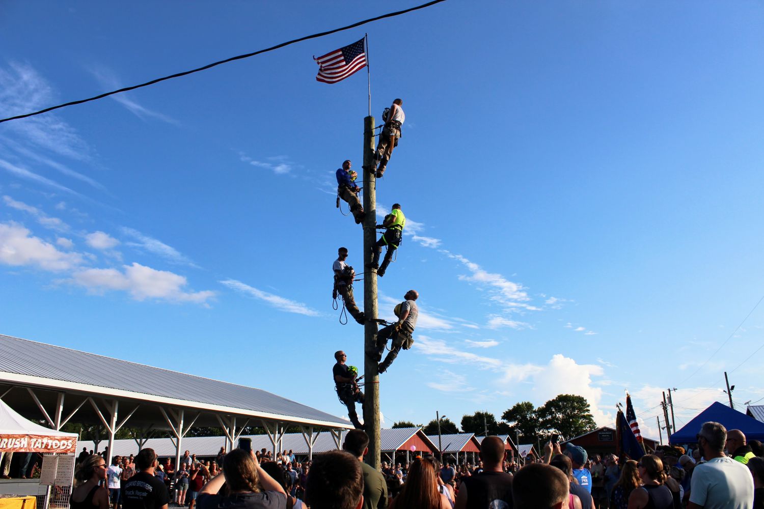 Flag put atop the telephone pole before national anthem