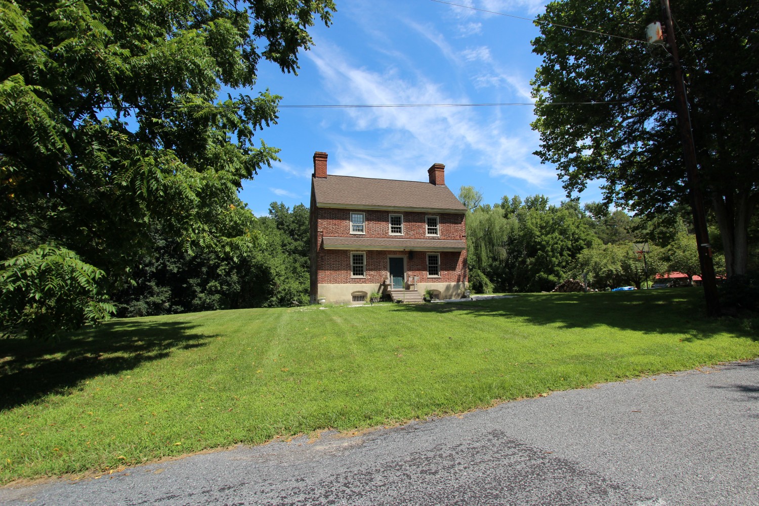 Set back across a expansive green lawn off Brickyard Road the Dickinson House remains a quiet masterpiece of local craft history.
