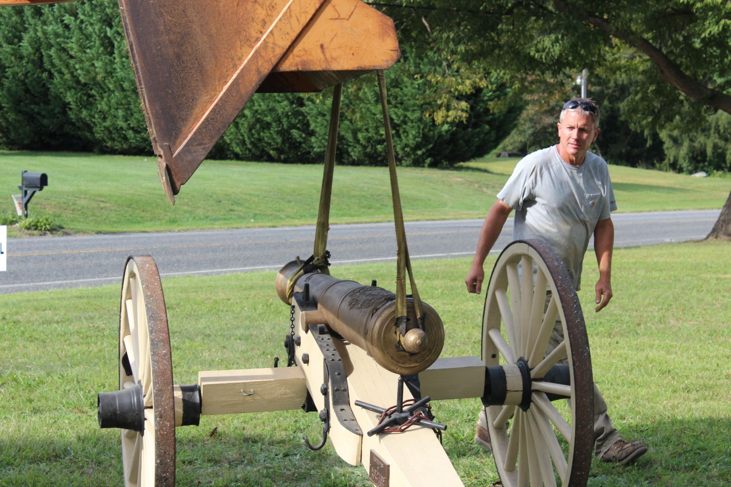 How do you move a 800-1000 lb cannon... very carefully with a bulldozer