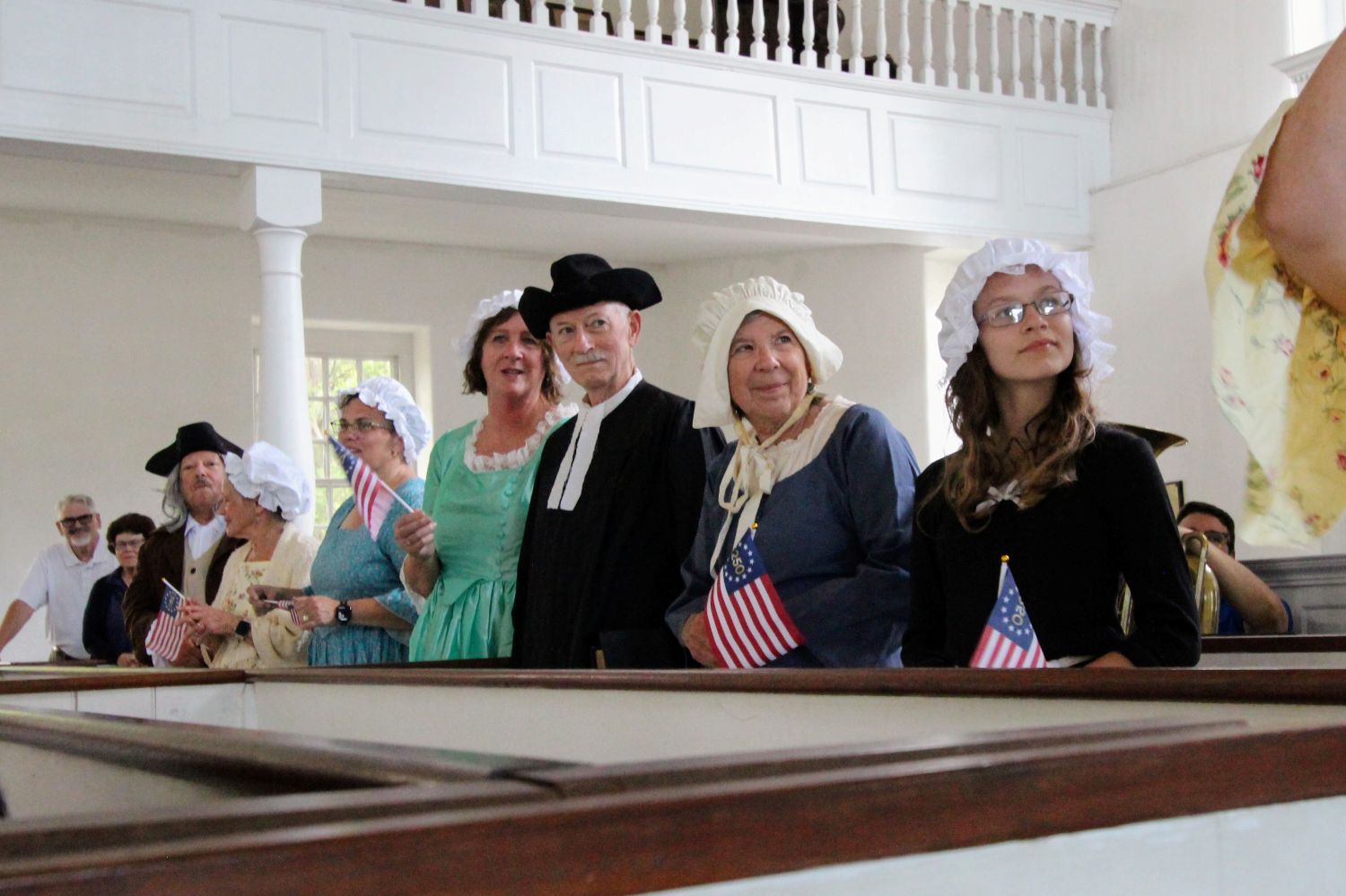 Members dressed in old attire being voted on for best custome