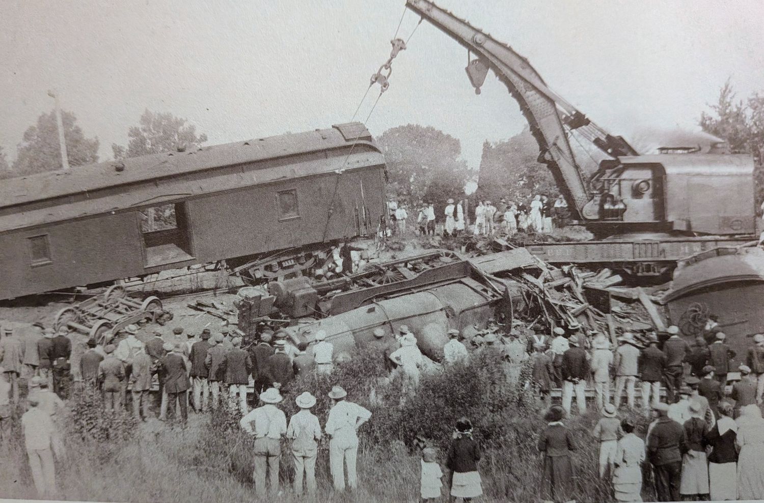 Crews work to clear the wreckage as much of Alloway turns out to watch — a scene both period accounts describe as drawing most of the township to the tracks. Photo: Alloway Remembers