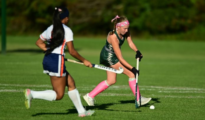 1000014438 Schalick's Morgan DuBois (R) moves in to score her first career goal that sent the Cougars on their way to a 3-1 win over Overbrook. (Photo by Heather Papiano)