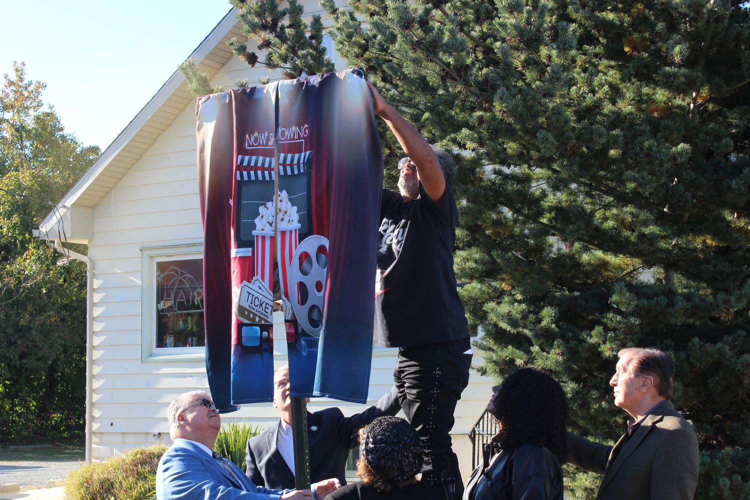 Councilman Greg Martin unveiling the street sign during yesterday's ceremony