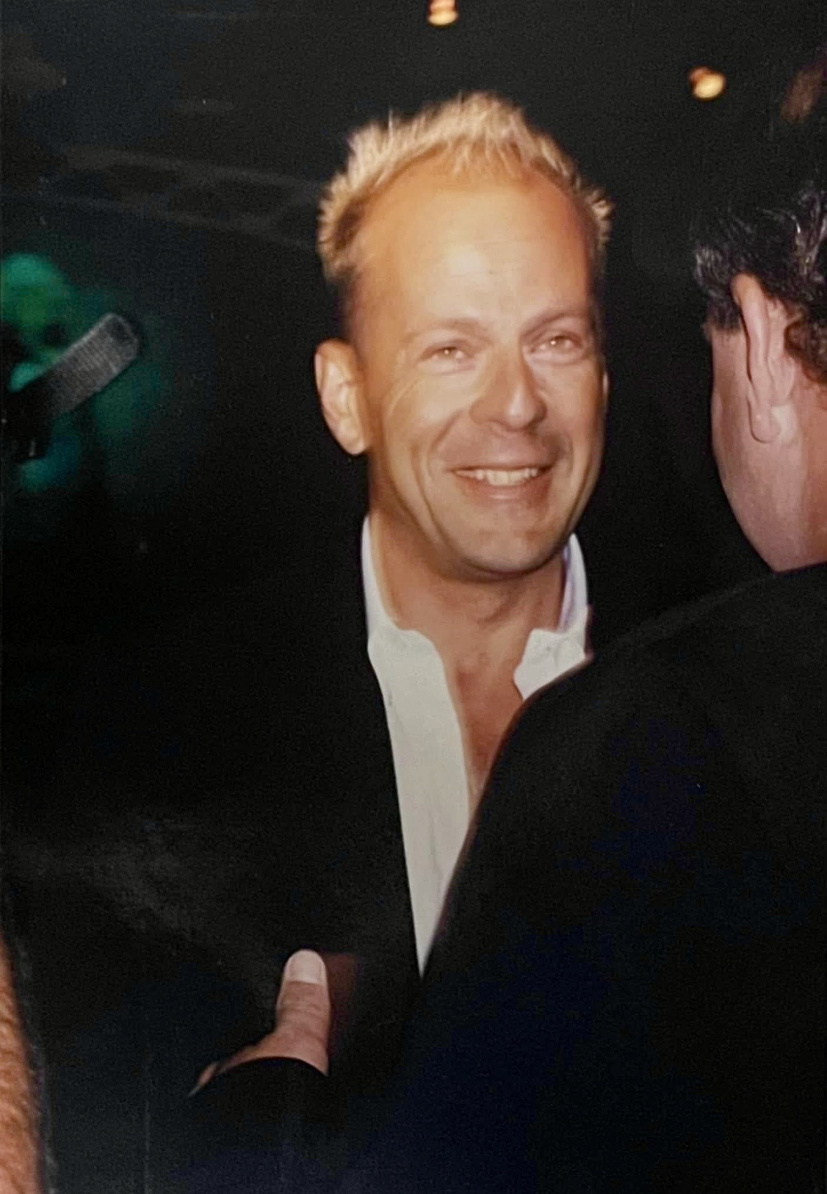 Bruce Willis looking up for a photo