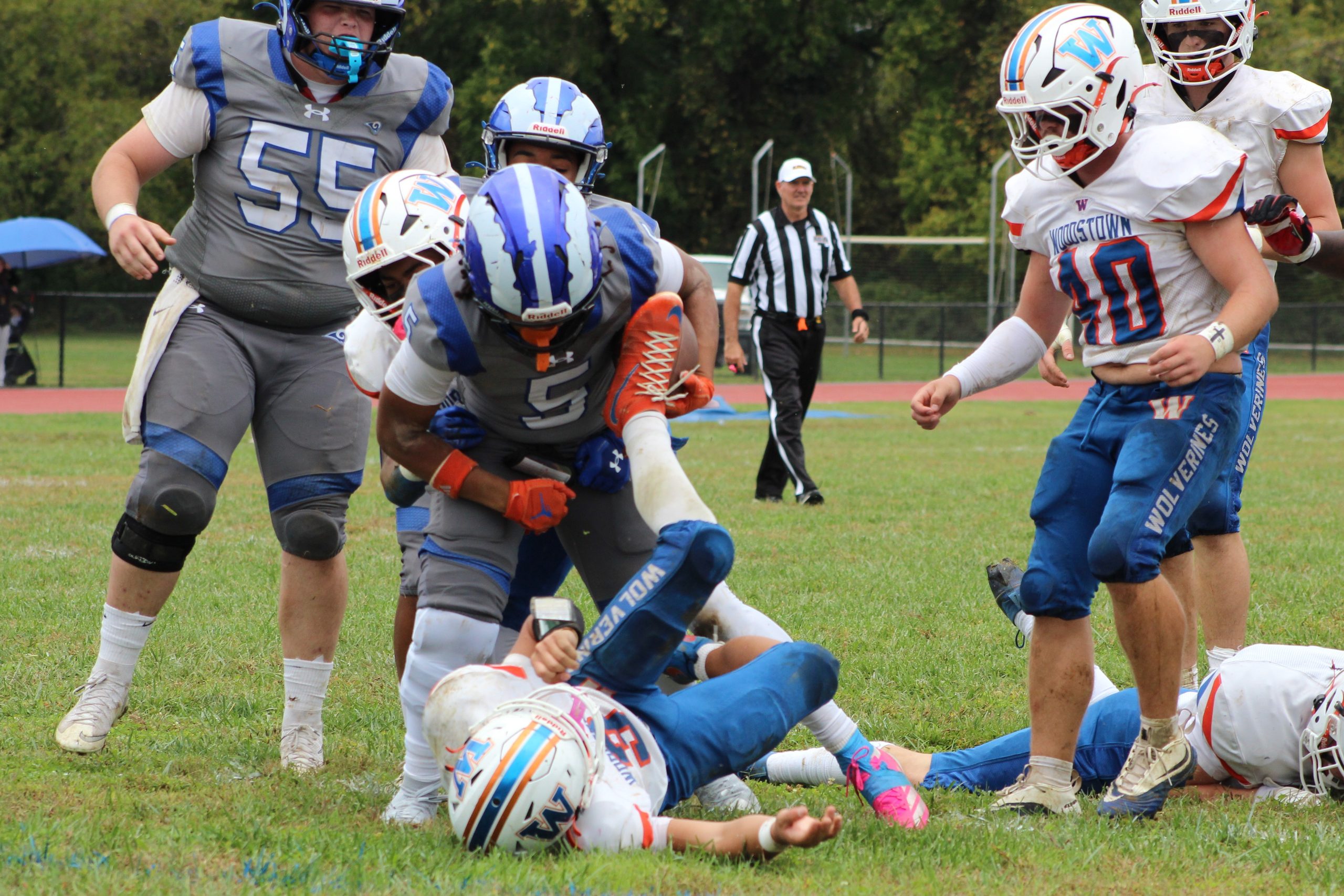 No 5 Izaiah Santiago runs over a defender into the endzone