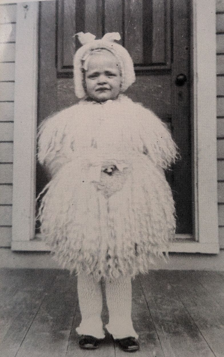 Mildred Plummer all dolled up for the carnival and nobody to take her there." She appears again by name in the Canton School class photograph on page 29 of the same book, standing in the front row. (How Dear to My Heart, p. 32)