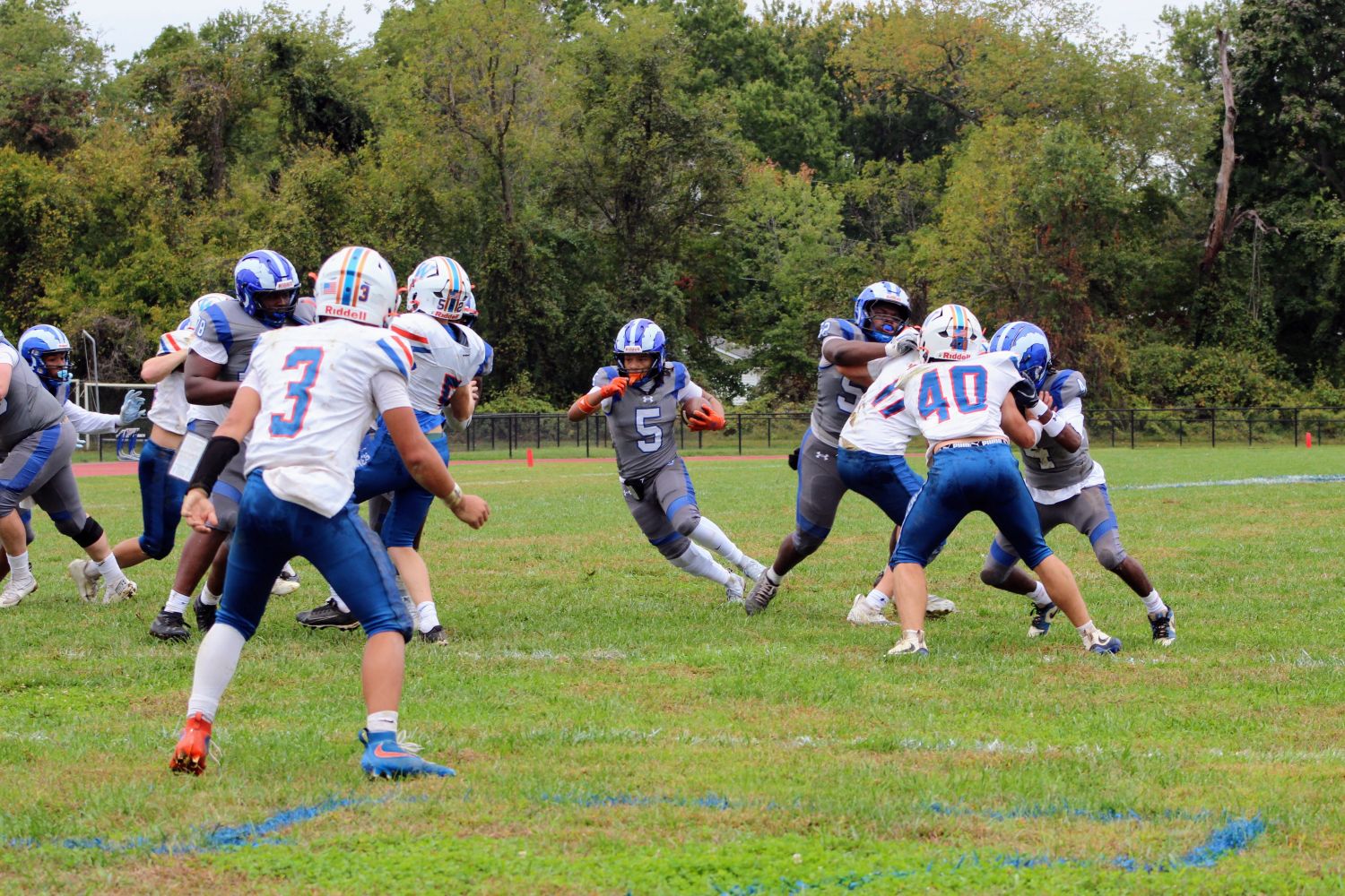No 5 Izaiah Santiago cutting through a hole
