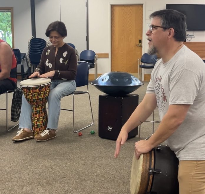Tim Simmons leads a community drum circle Oct. 3 at the Gloucester County Library in Mullica Hill. About 15 people took part, including his sister, Assemblywoman Heather Simmons. Tim Simmons leads a community drum circle Oct. 3 at the Gloucester County Library in Mullica Hill. About 15 people took part, including his sister, Assemblywoman Heather Simmons.