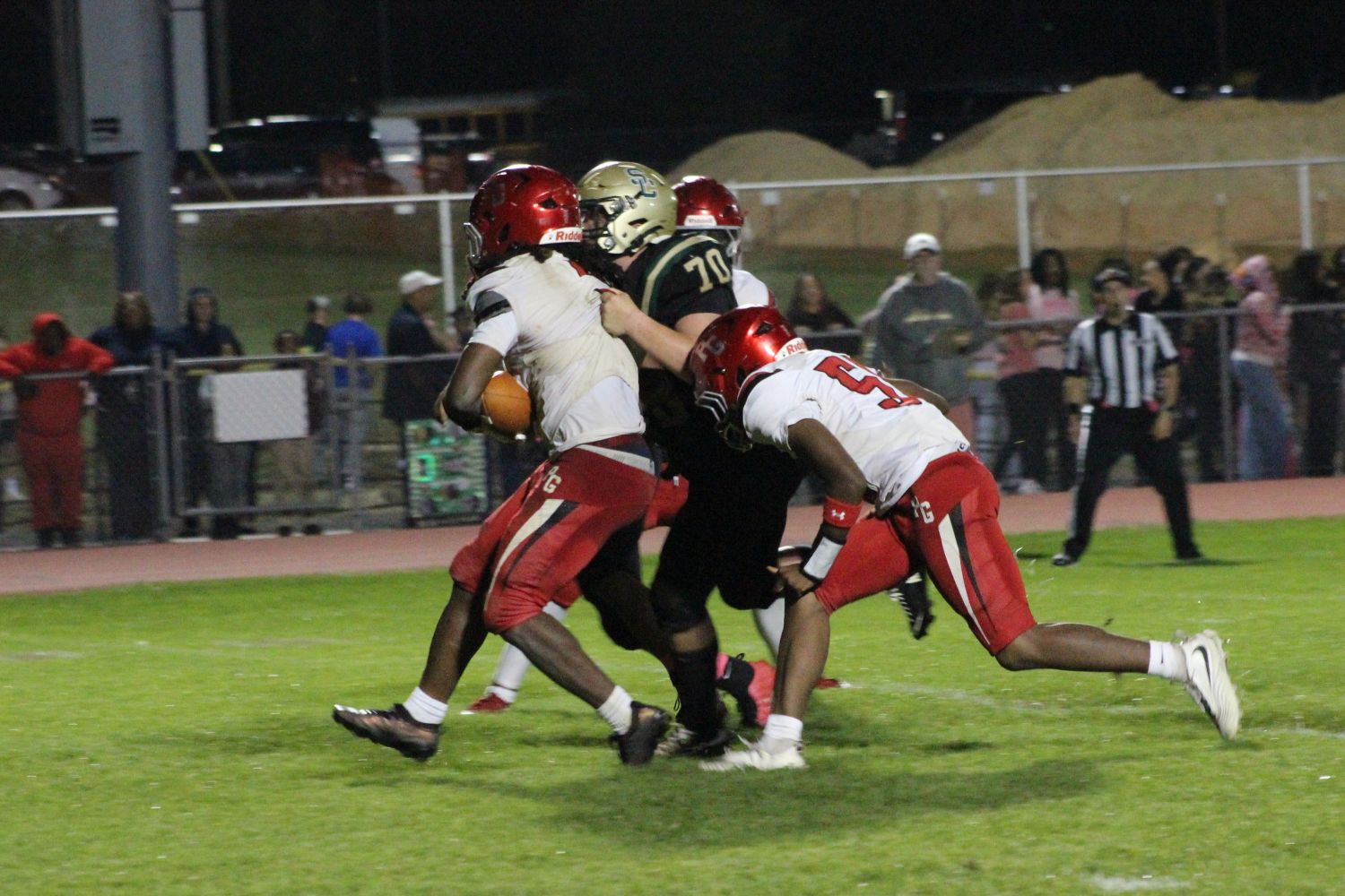 Schalick's #70 Aiden Torres with a stop on Penns Grove #5 Terrell Thomas