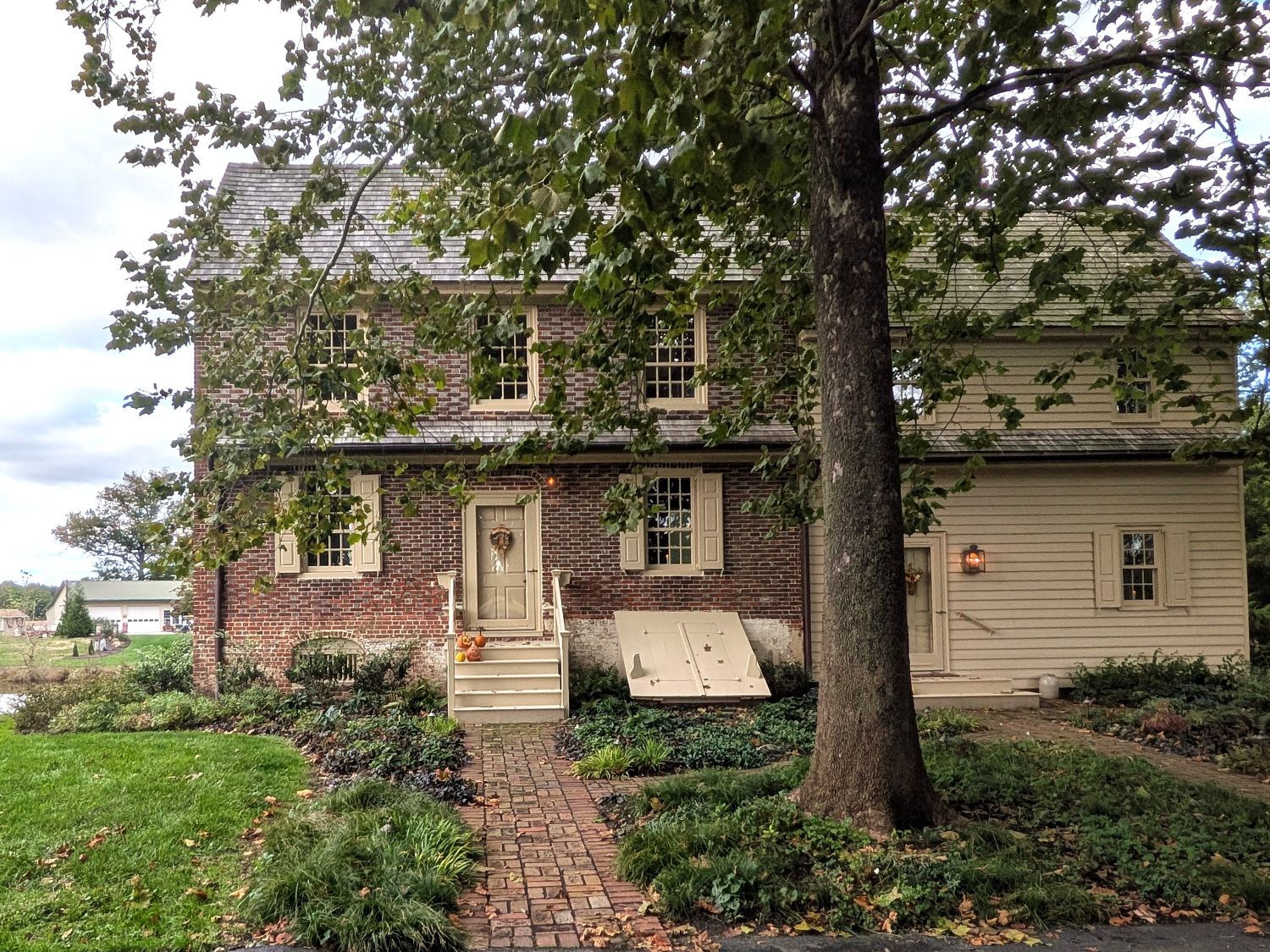 The front of the house, with the brick walk and cellar bulkhead. Photo: The News of Salem County.