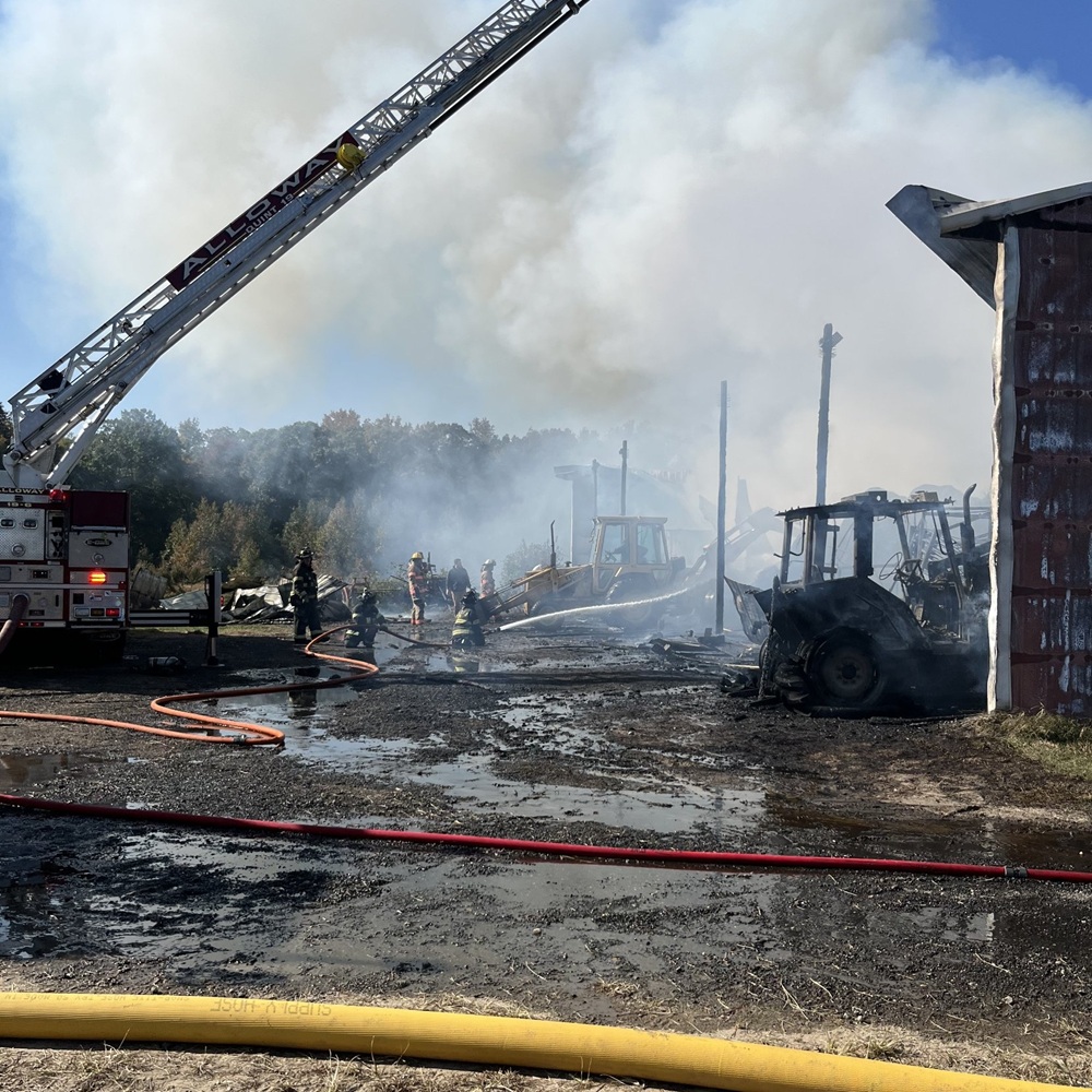 Alloway’s ladder truck was positioned over the barn as firefighters hit the flames below.